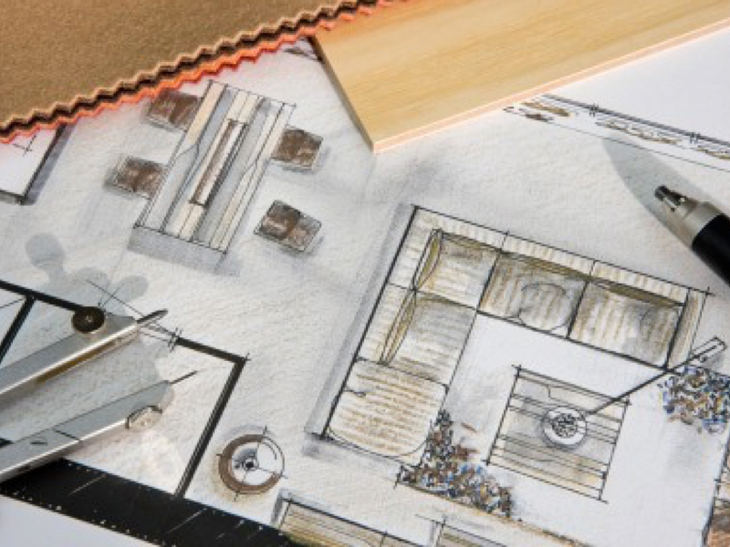 Fabric and color swatches arranged on a design plan